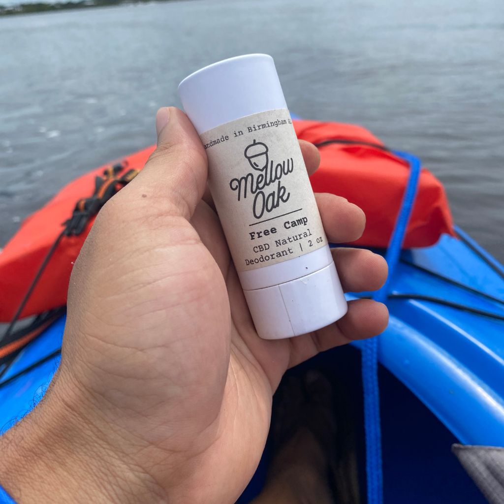 cbd natural deodorant outside on the water in a kayak