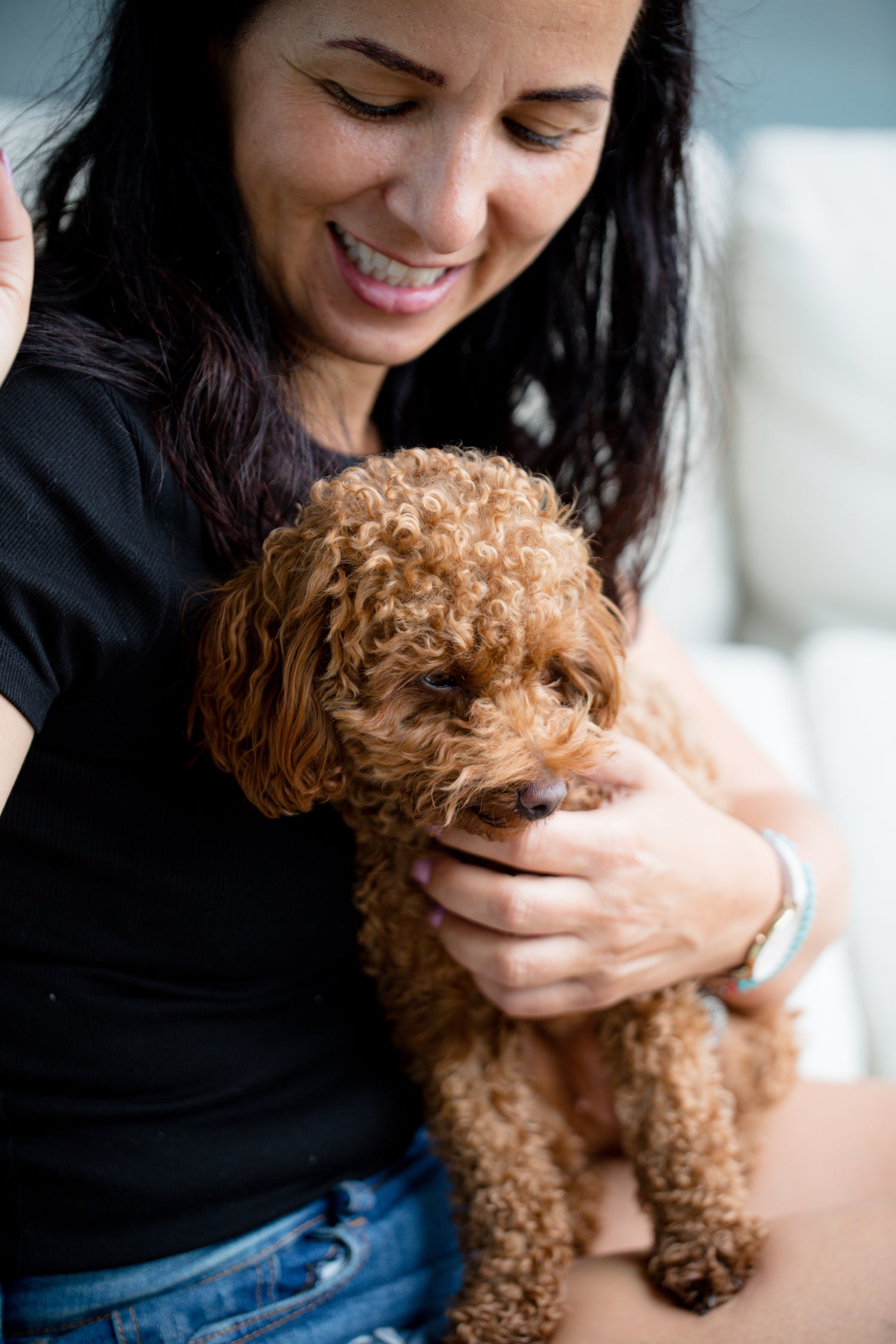 woman with dog on a couch