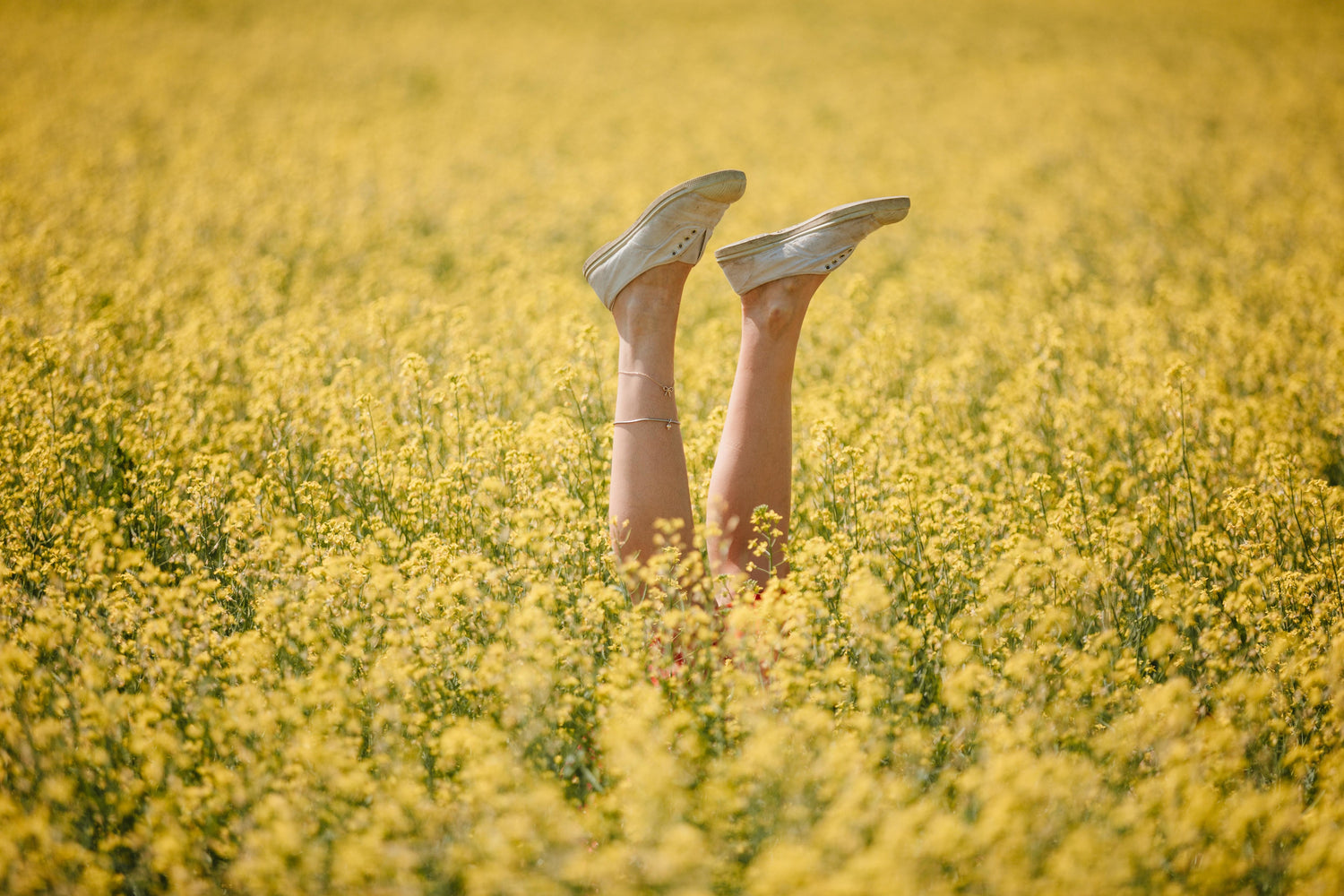 Woman's feet in the air. Happy and itch-free after applying our CBD bite relief itch cream.