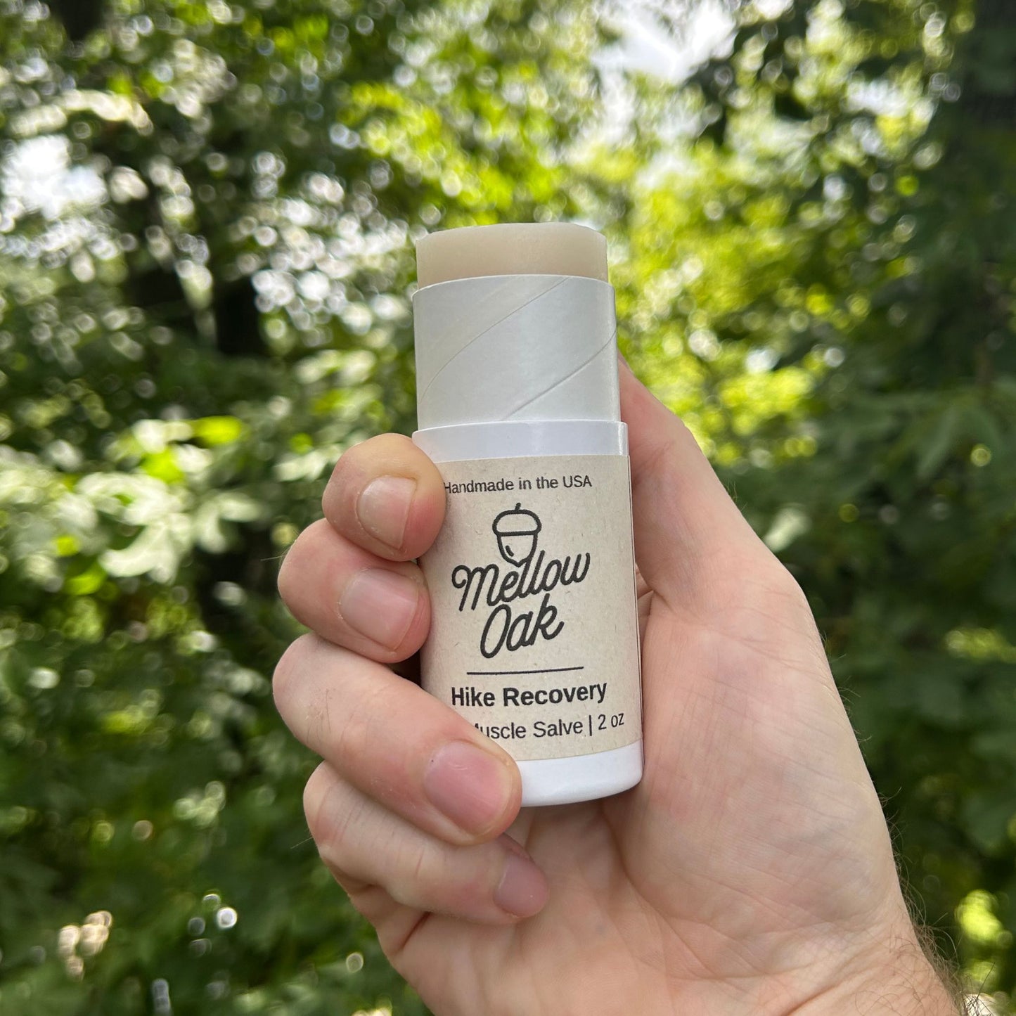 Push up tube to roll on the cbd muscle salve outdoors by trees